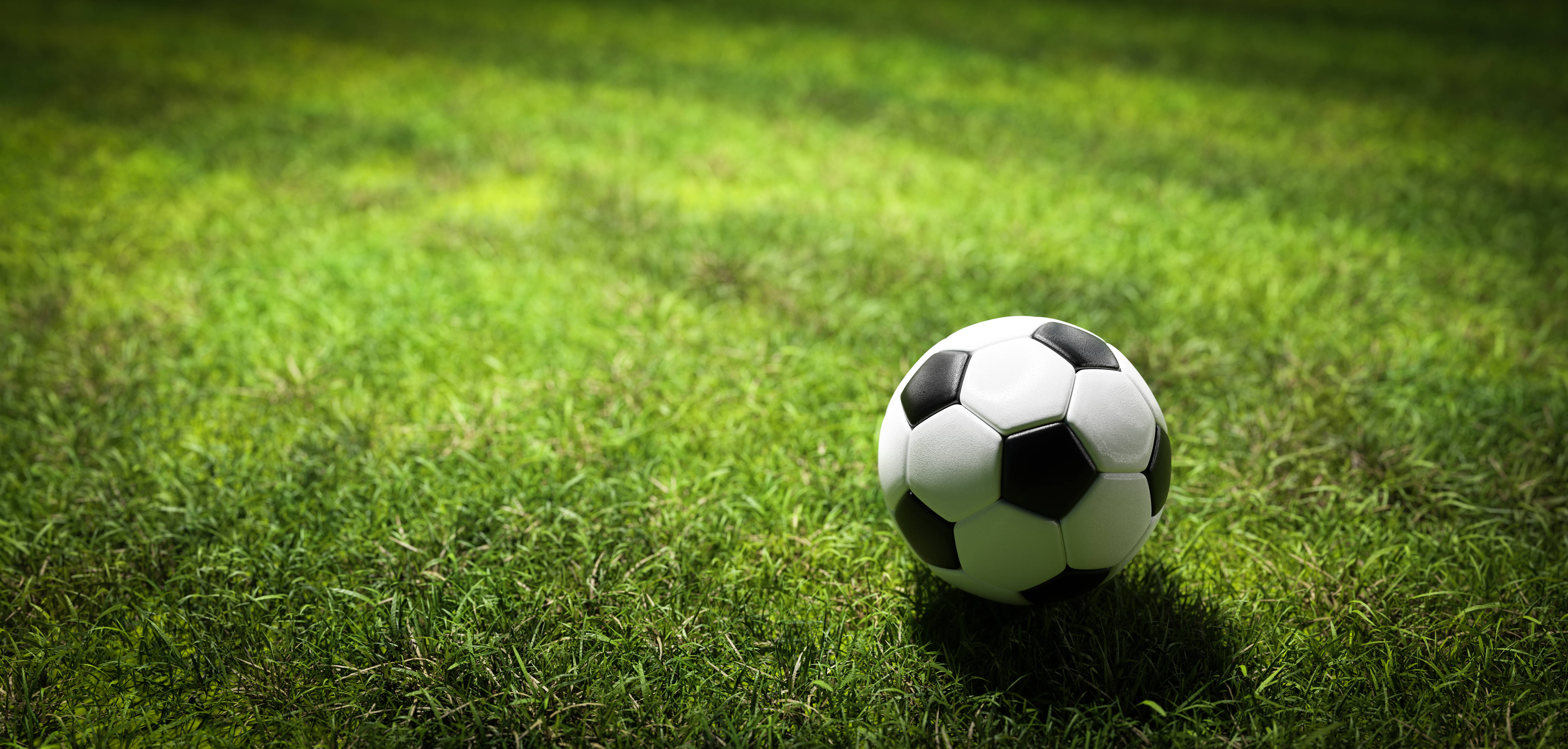 football-soccer-ball-on-grass-field-2