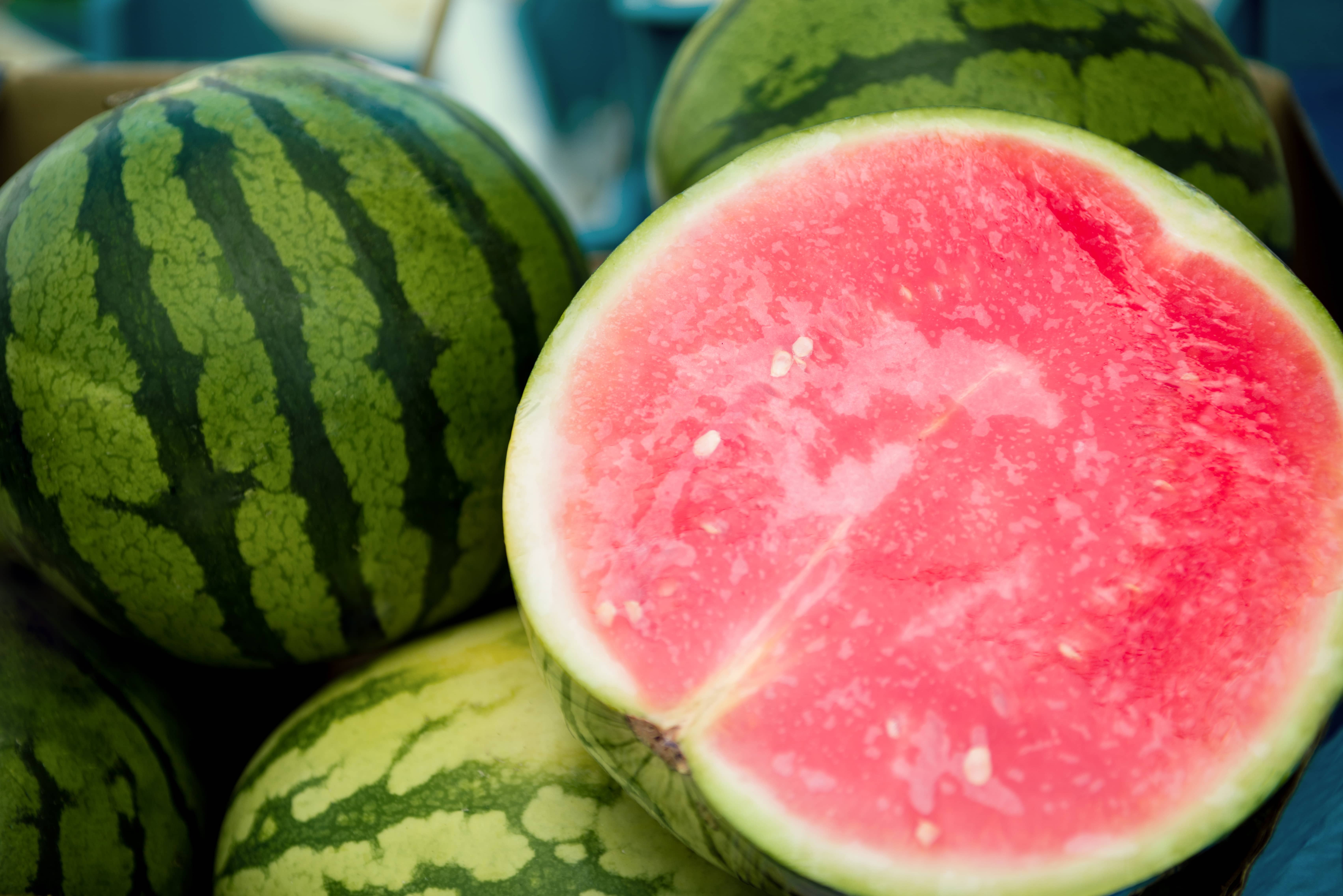 close-up-view-of-half-of-watermelon-and-watermelons