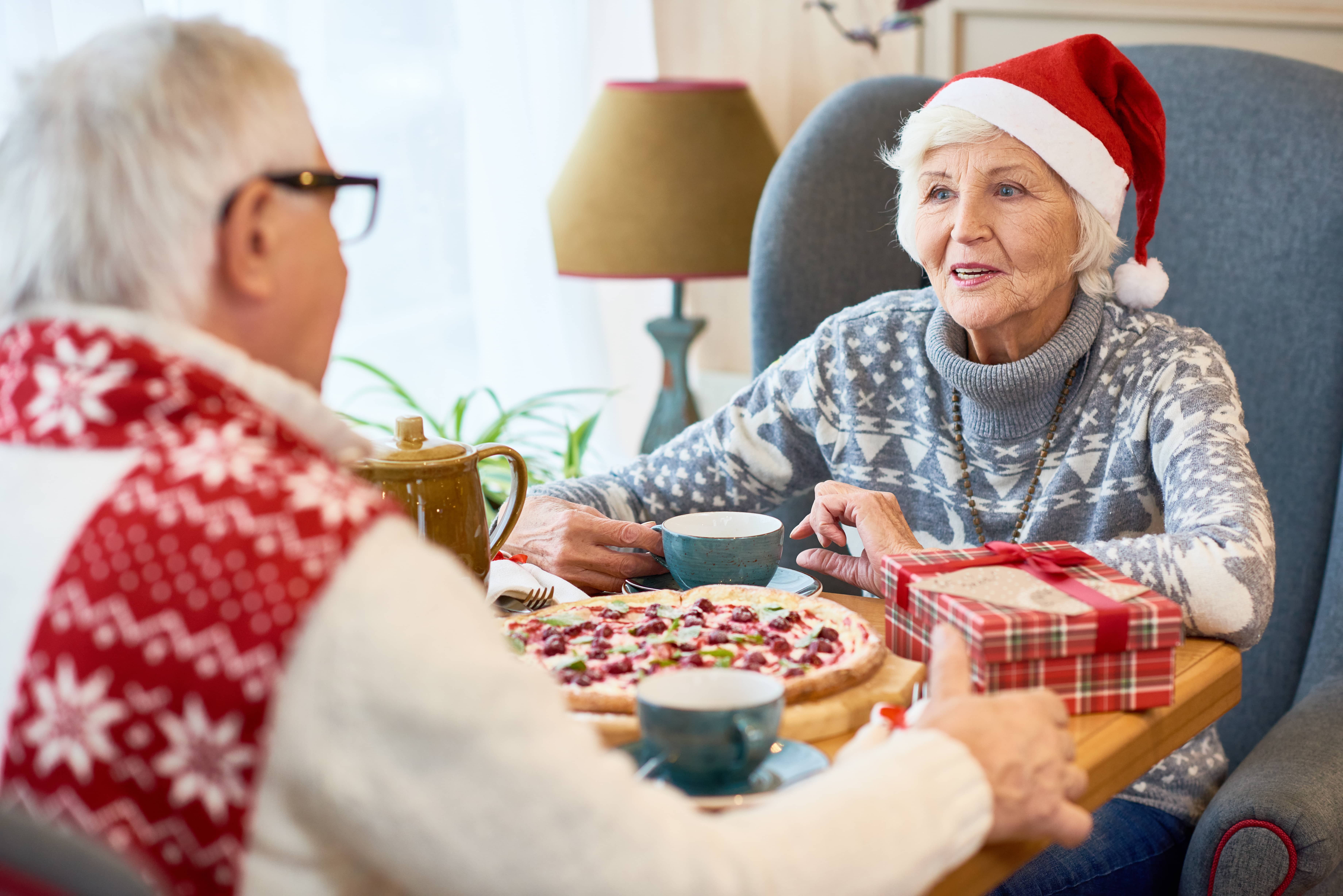 happy-senior-couple-dining-on-christmas