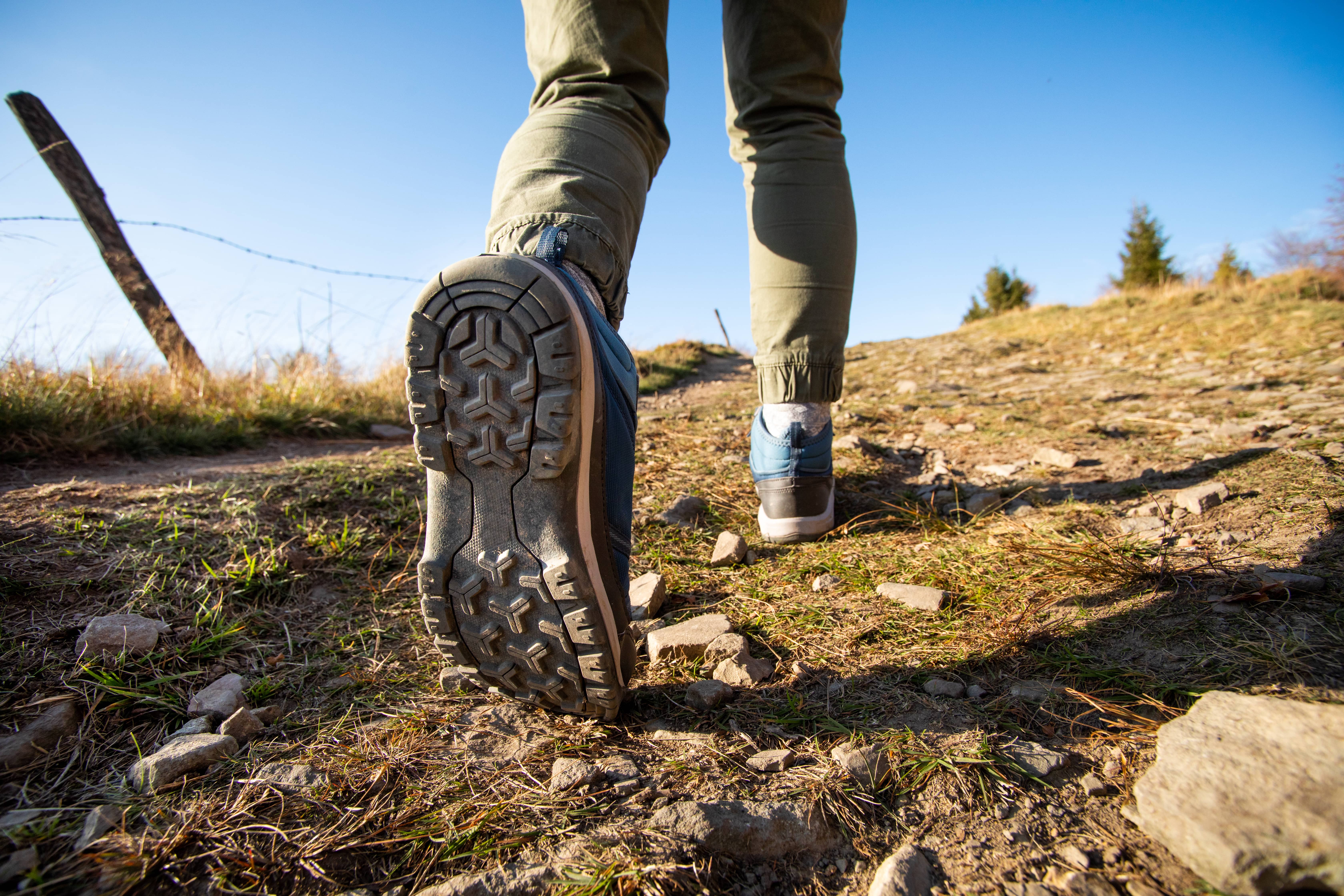 woman-hiker-walking-through-the-mountains-with-professional-boots