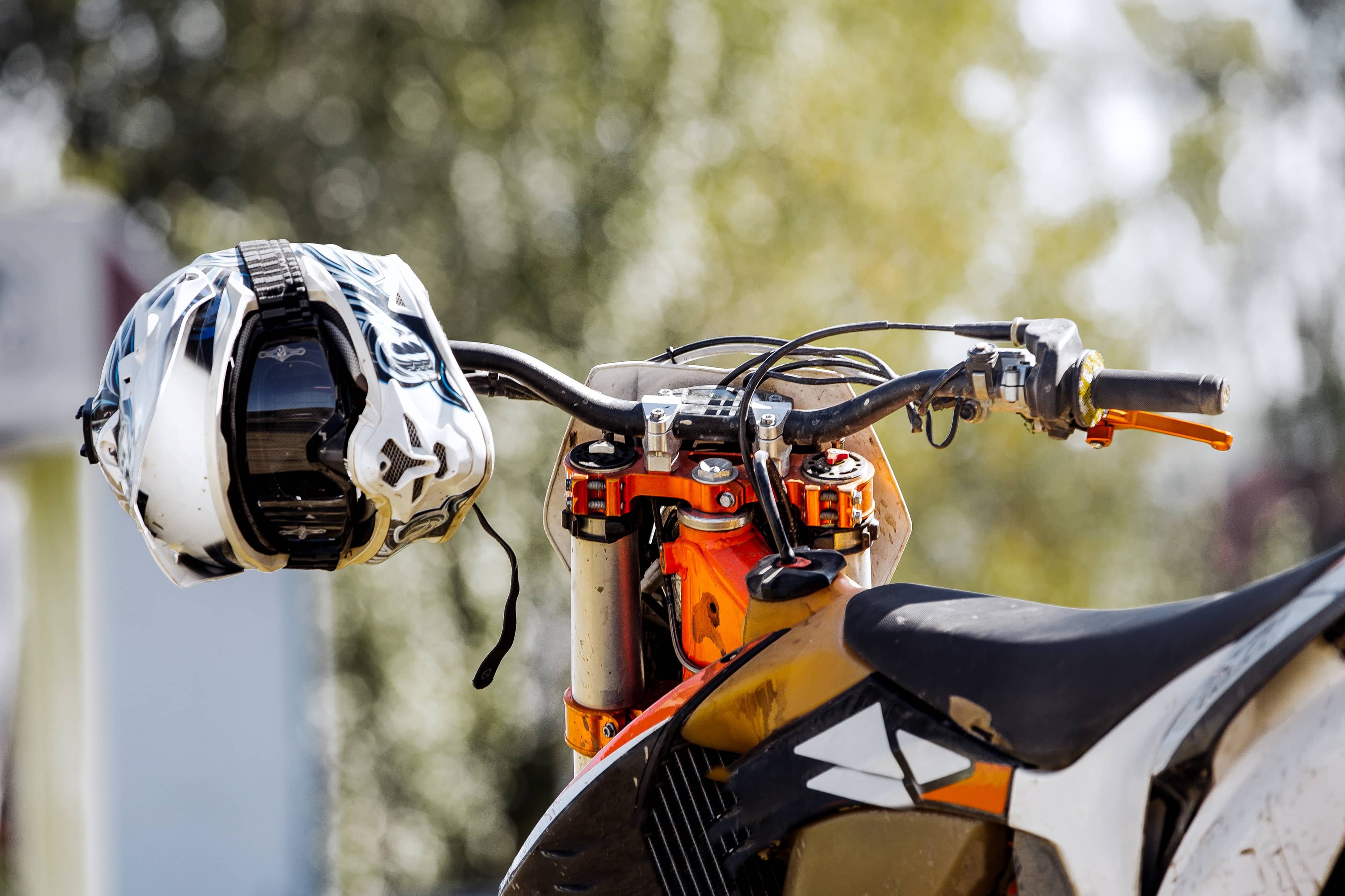 closeup-sports-helmet-hanging-on-handlebars