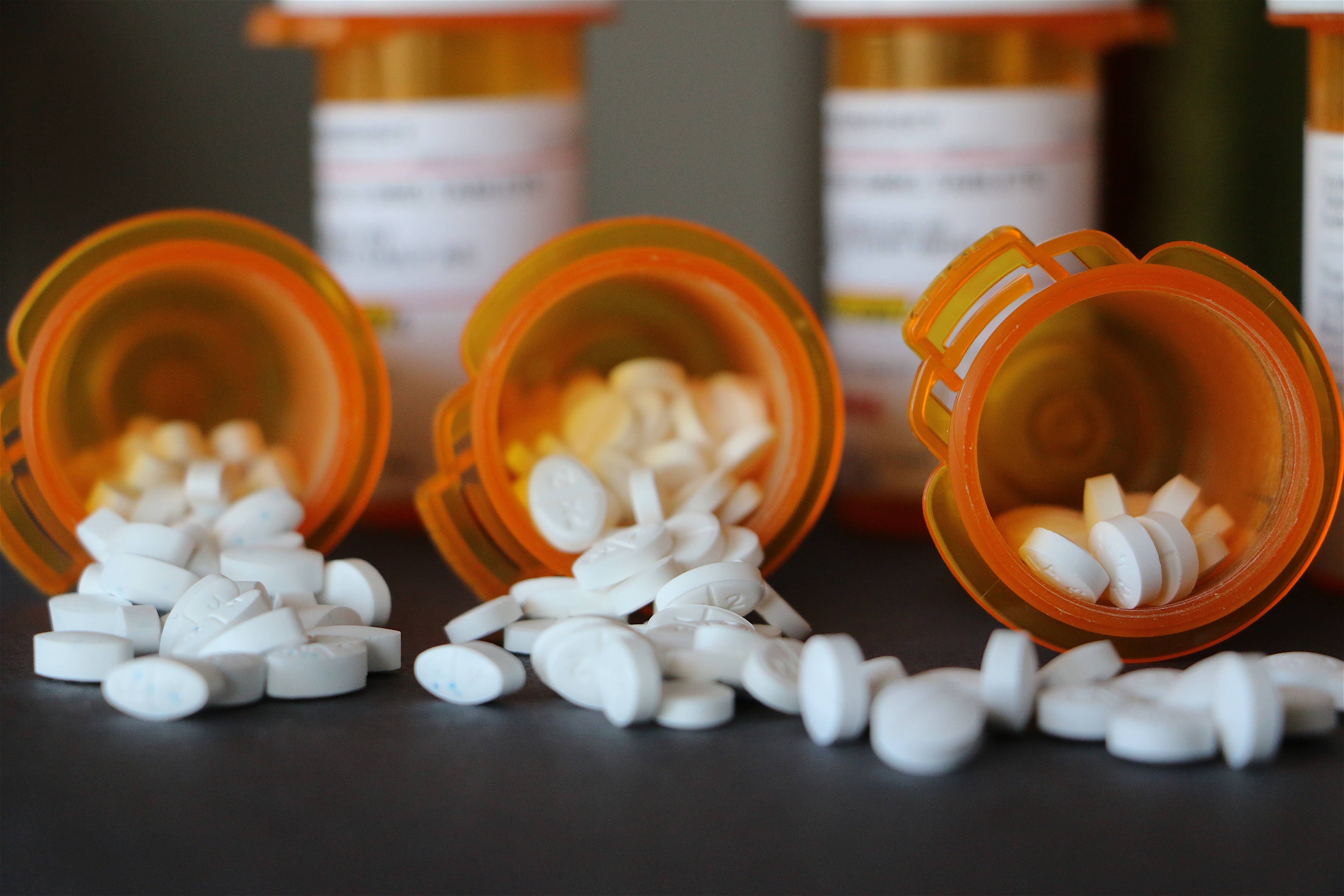 prescription-drugs-white-pills-spilling-out-of-p-2022-08-01-01-10-56-utc