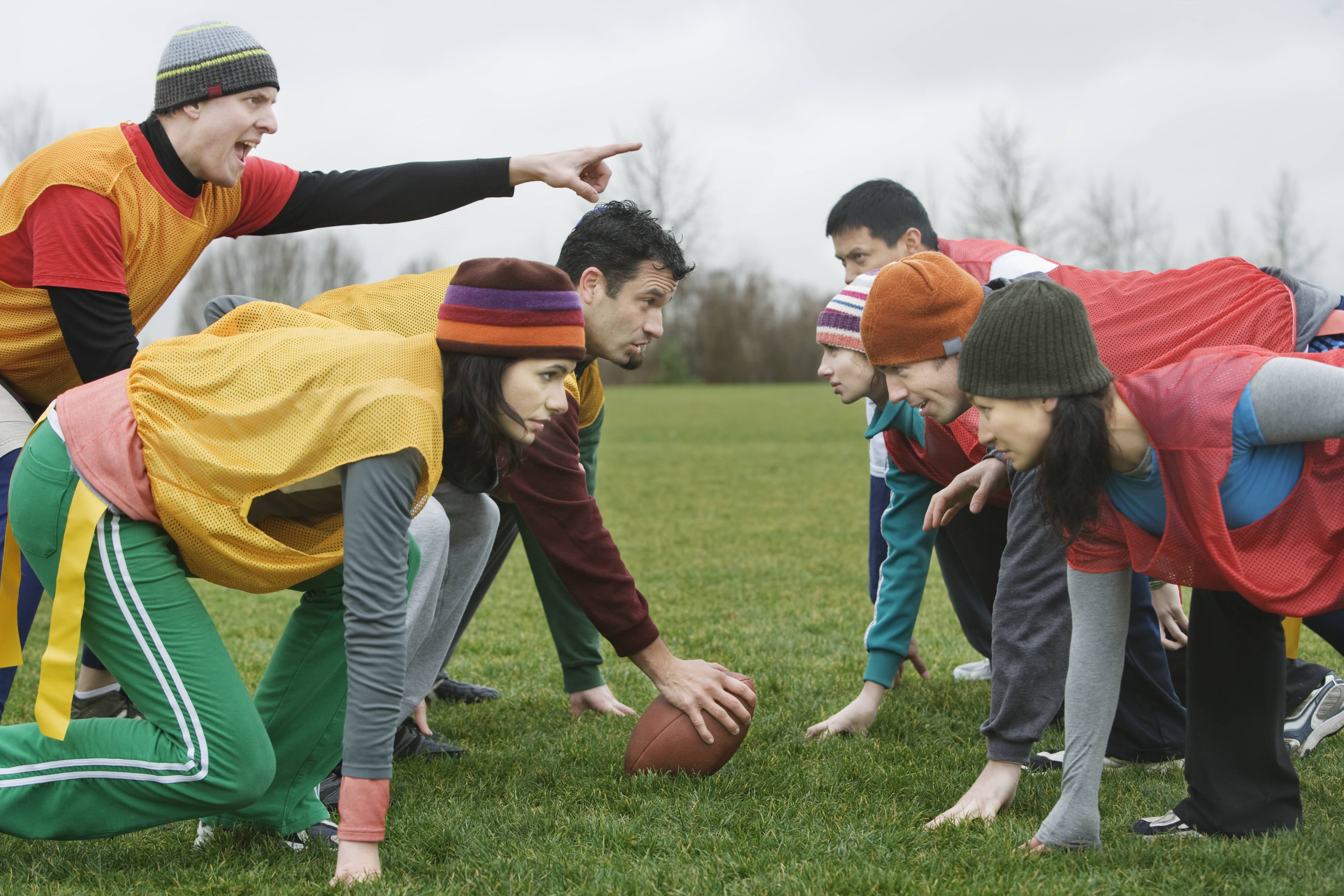 caucasain-man-playing-quarterback-for-an-non-contact-flag-football-team-of-friends-usa