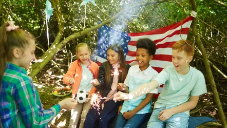 american-kids-lighting-sparklers-outdoors