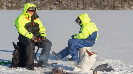 two-men-ice-fishing-on-the-frozen-winter-lake-war-2023-11-27-05-25-37-utc