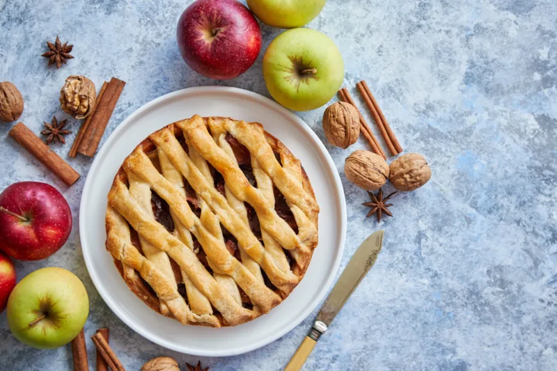 fresh-baked-tasty-homemade-apple-pie-cake-with-ingredients-on-side