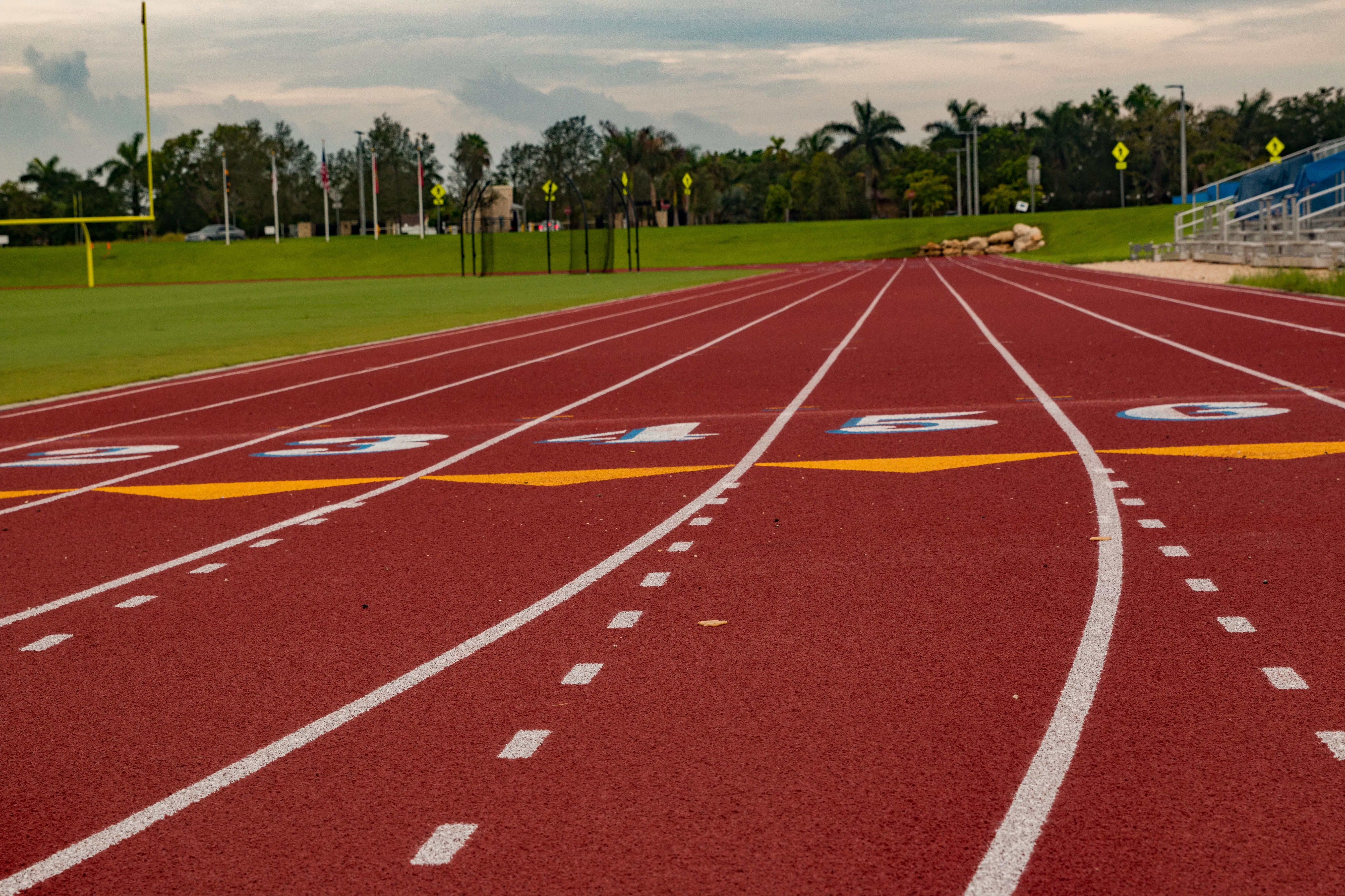 a-closeup-of-a-red-high-school-track-and-a-field-2023-11-27-05-35-45-utc