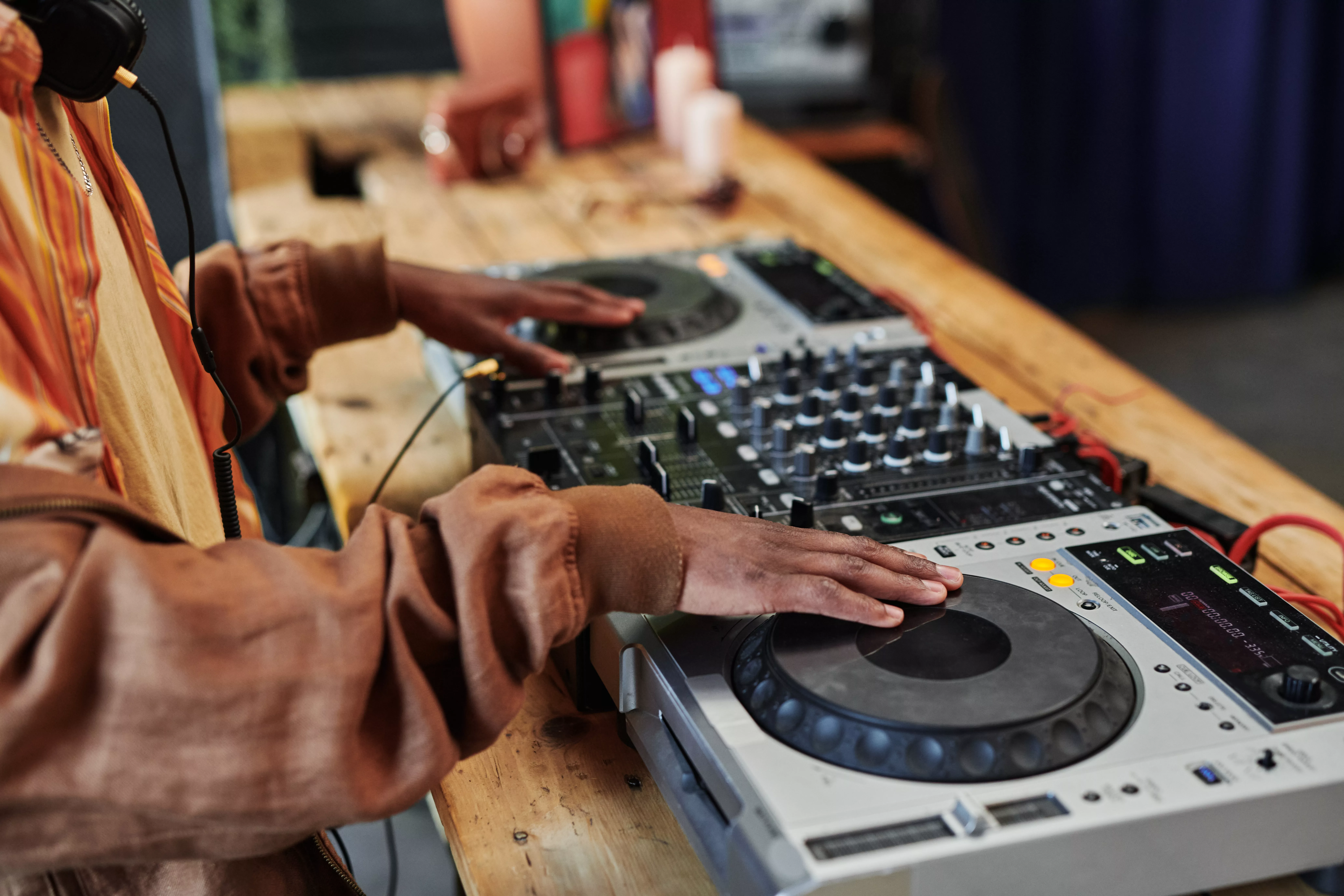 hands-of-black-man-creating-new-music-and-recording-it-for-entertainment-event