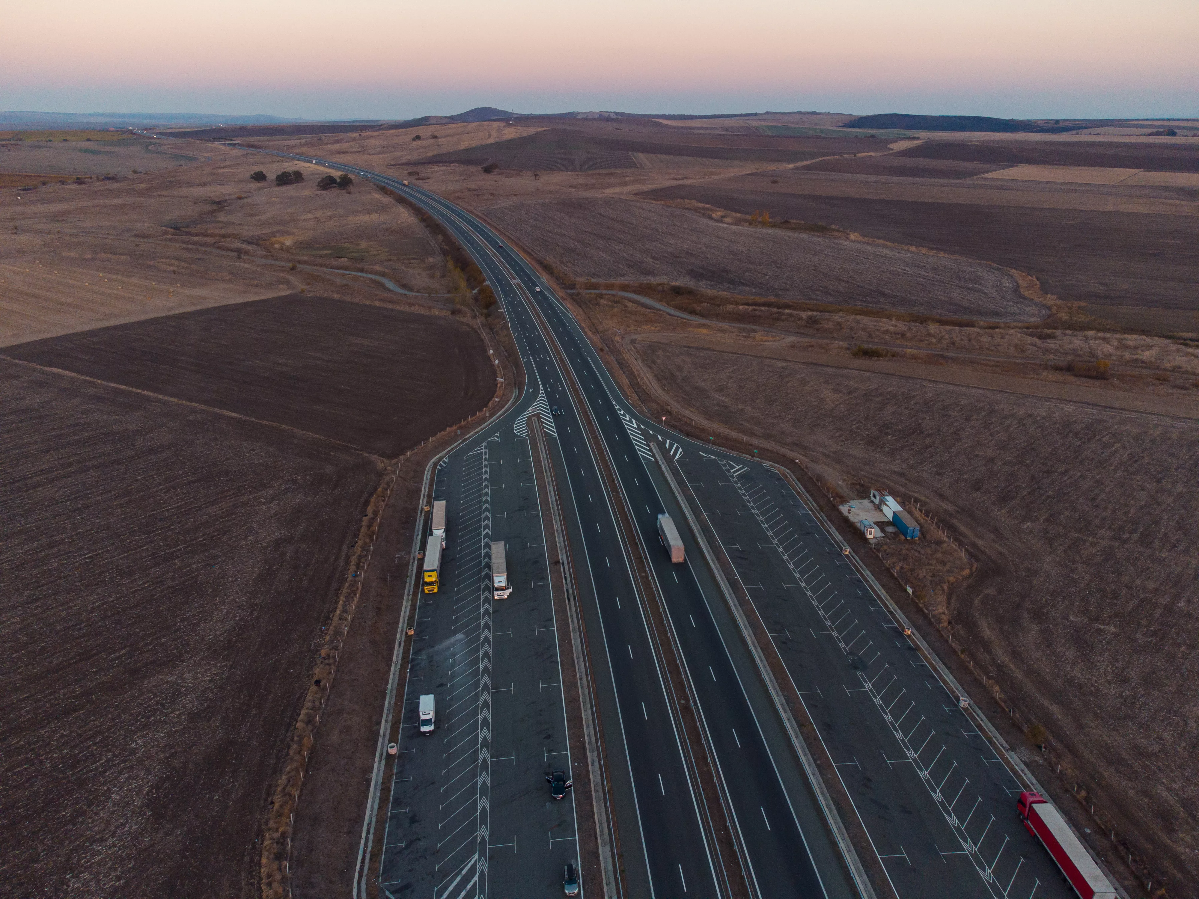 aerial-view-of-highway-road-at-sunset-in-autumn-top-view-from-drone-of-road