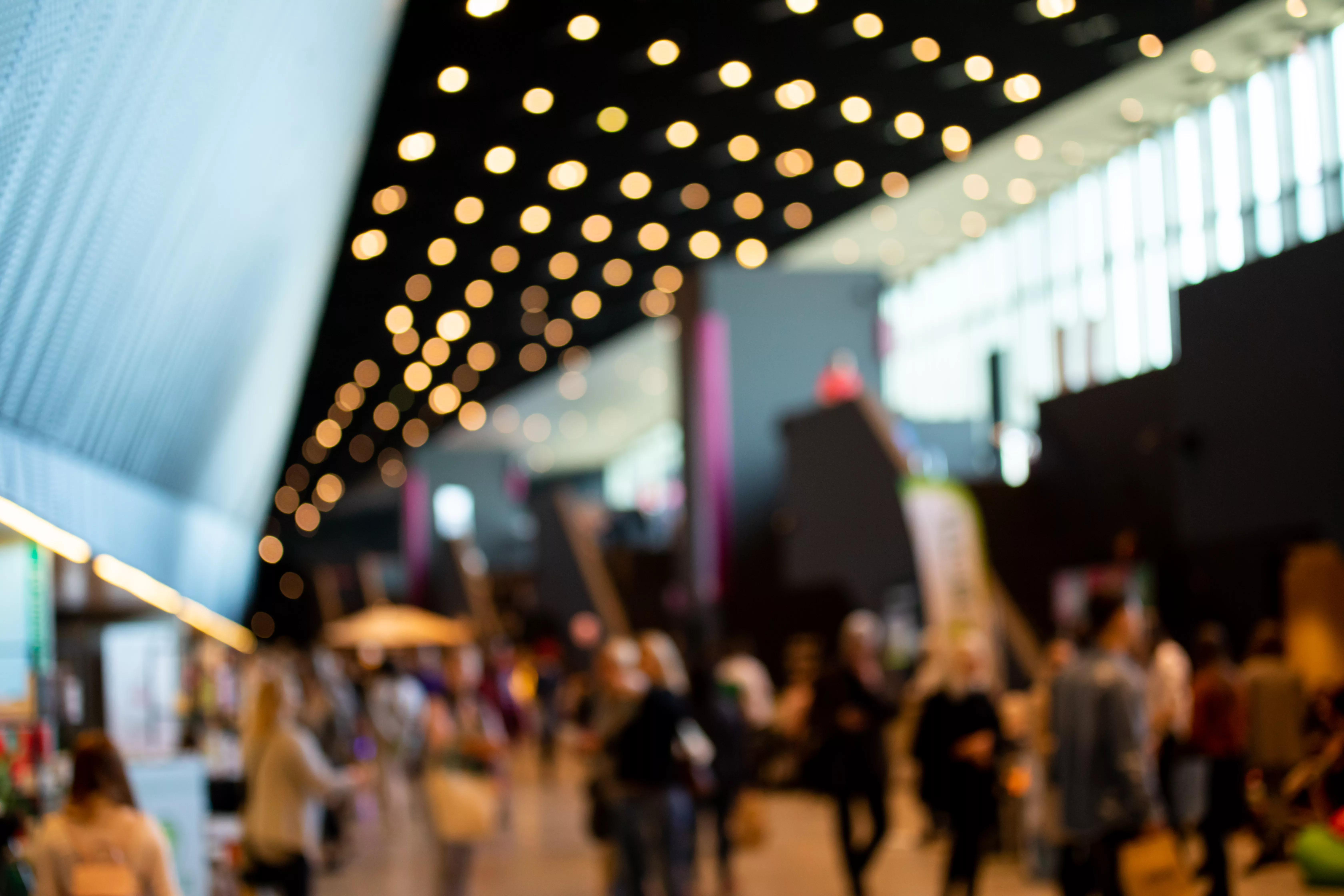blurred-crowd-of-people-in-modern-interior-during-event