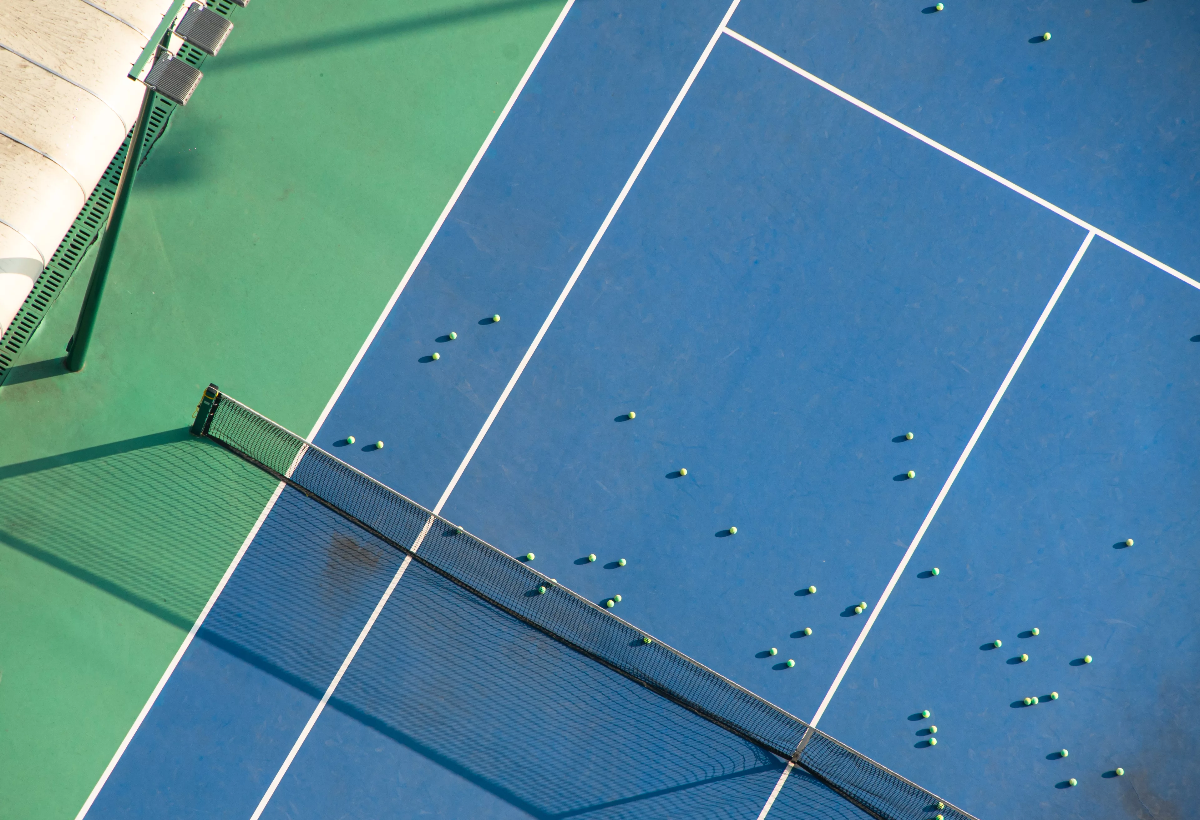 aerial-view-of-young-people-exercising-on-the-tennis-court