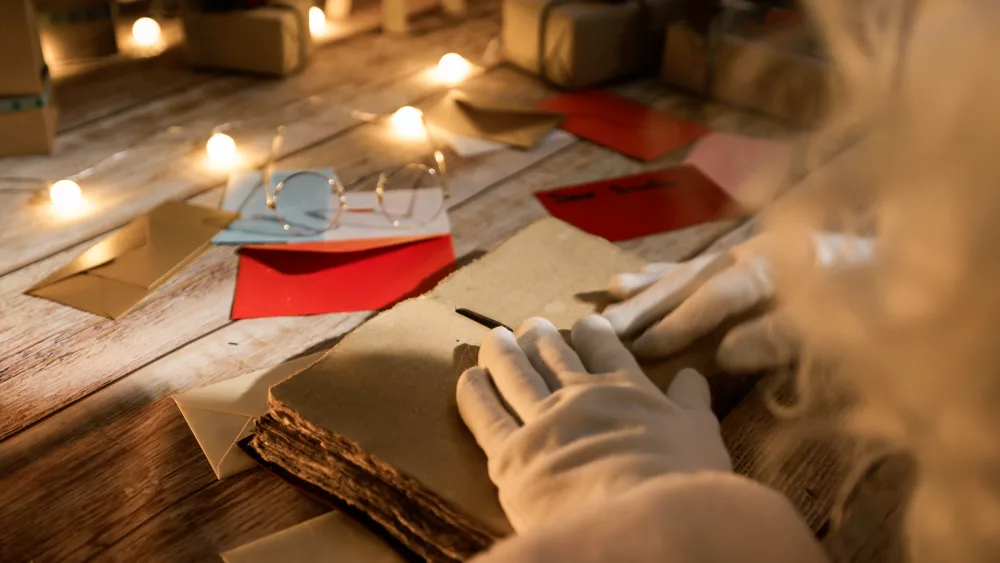 santa-claus-opening-and-reading-an-old-book