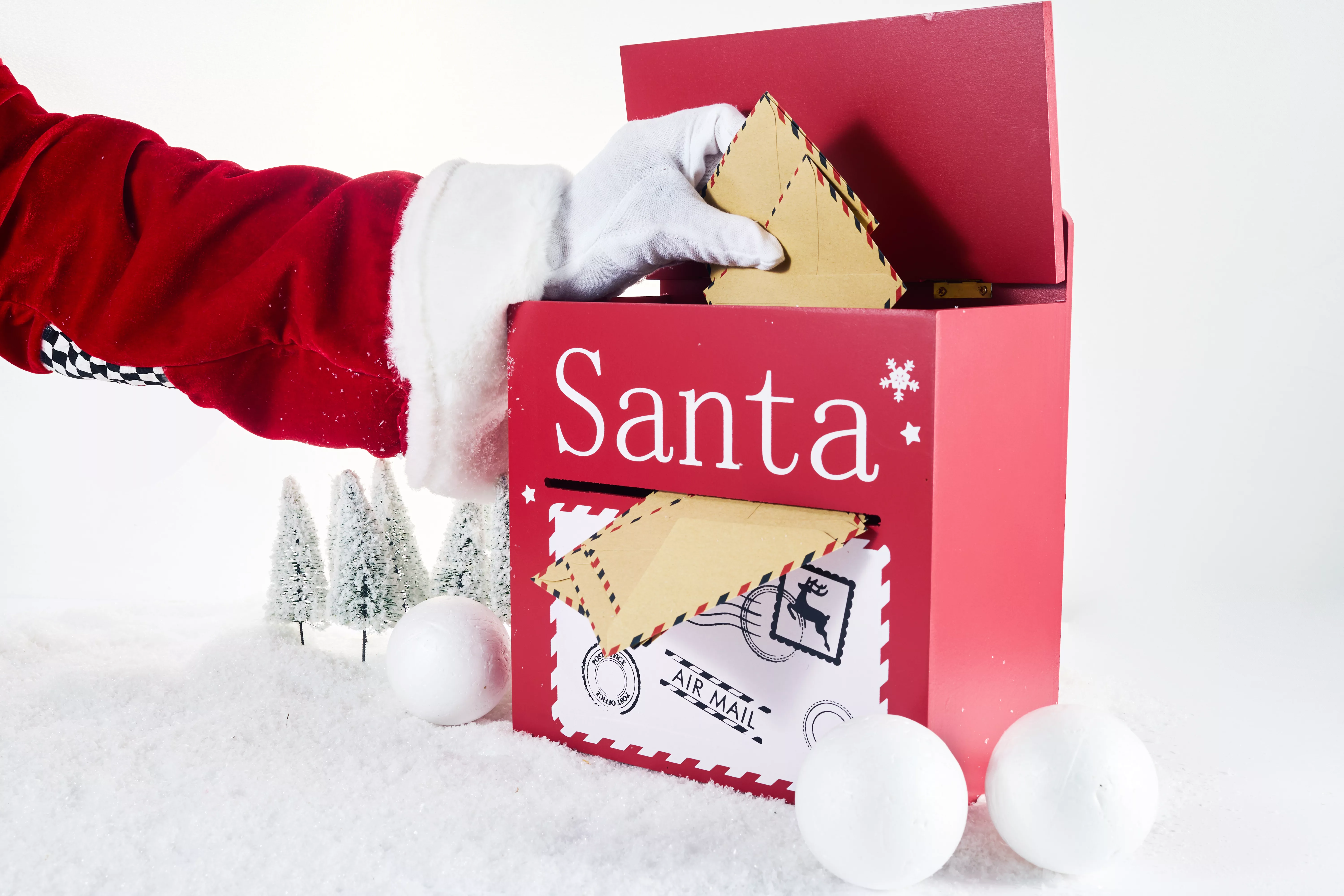 santa-claus-opening-his-mailbox-stuffed-with-letters