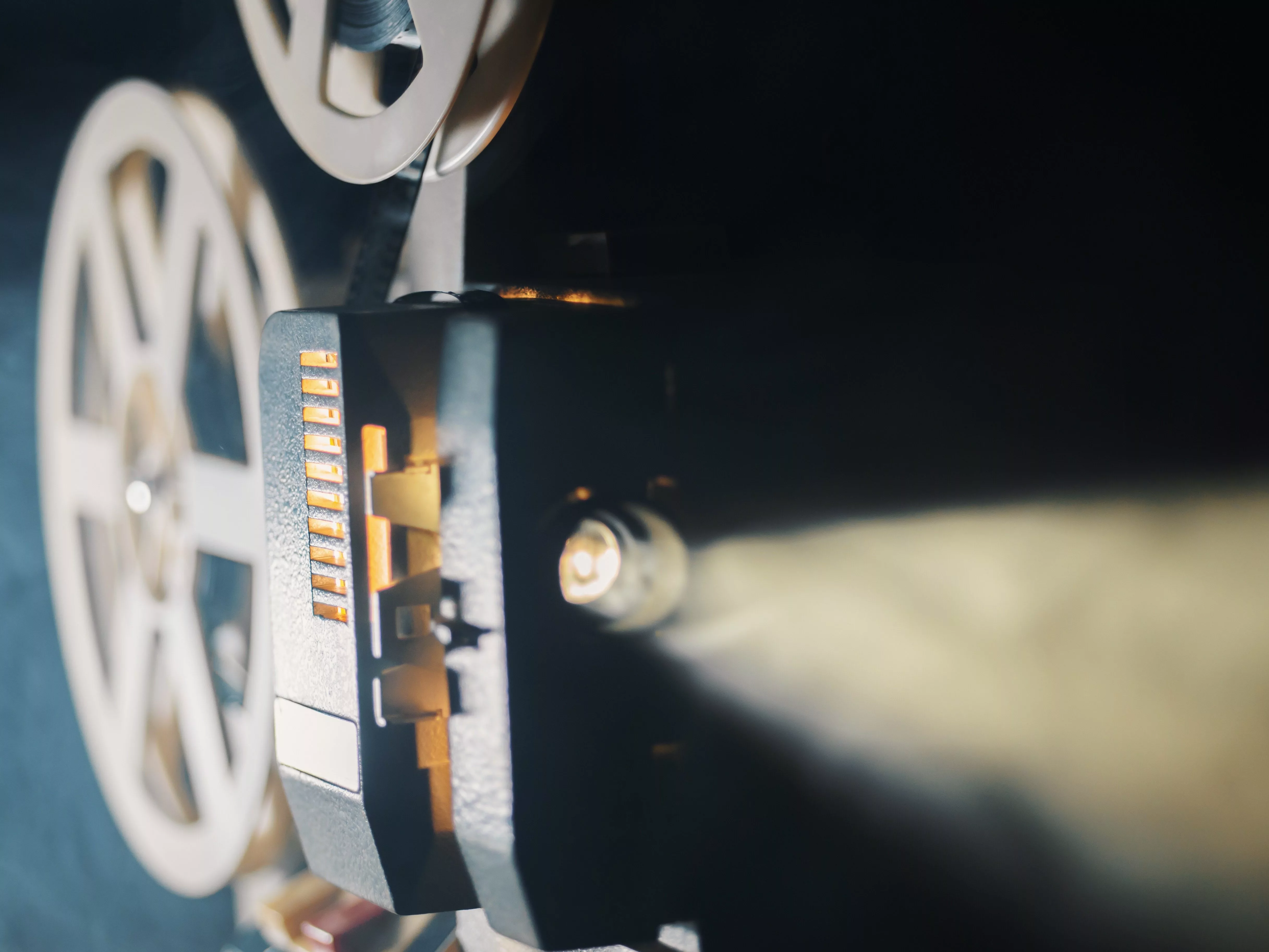 film-projector-on-a-black-background-with-dramatic-lighting-and-selective-focus