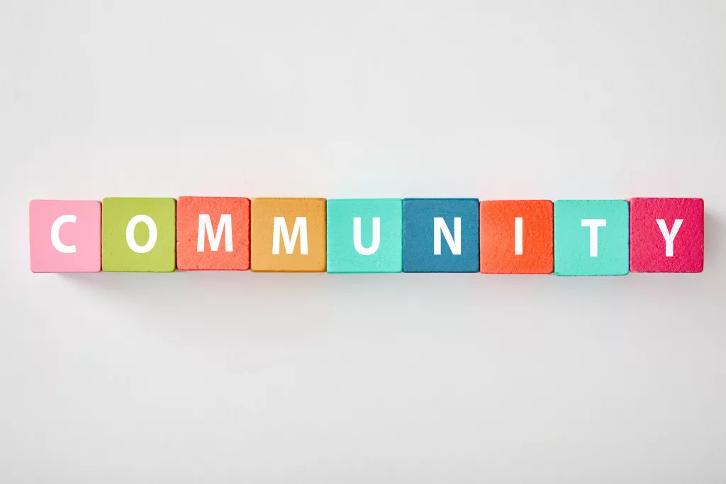 top-view-of-community-lettering-made-of-multicolored-cubes-on-grey-background-2