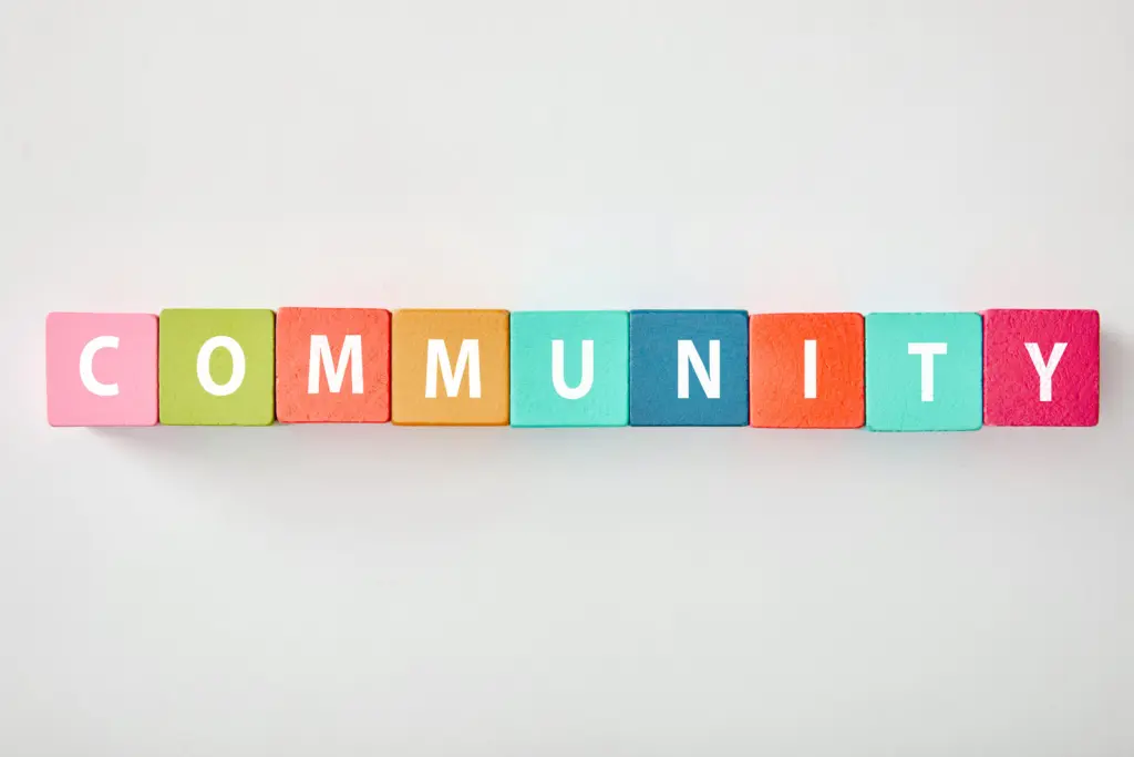 top-view-of-community-lettering-made-of-multicolored-cubes-on-grey-background-3