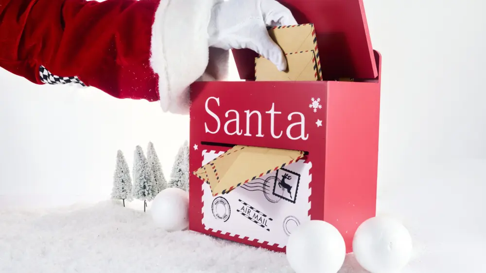 santa-claus-opening-his-mailbox-stuffed-with-letters-2