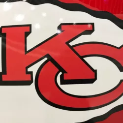 Closeup of Kansas City Chiefs helmet^ white and red^ displaying 'KC' logo