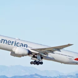 American Airlines Boeing 777-223(ER) aircraft is airborne as it departs Los Angeles International Airport. Los Angeles^ California USA