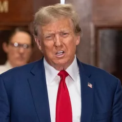 Former President Donald Trump speaks to the press before closing arguments at his civil fraud trial at State Supreme Court in New York on January 11^ 2024