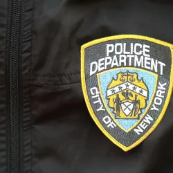 NYPD Police patch on black jacket uniform close up