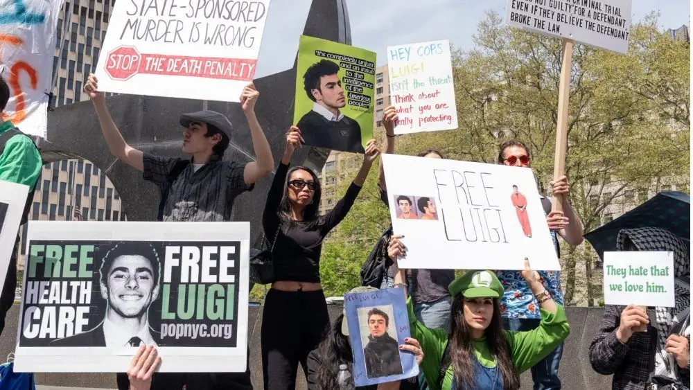 Activists gathered in front of Federal Court where Luigi Mangione was arraigned on Federal Charges accusing him of killing United HealthCare CEO Brian Thompson New York - April 25^ 2025