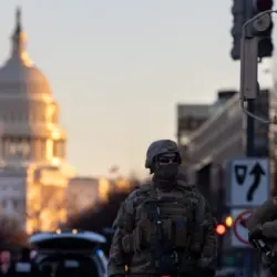 Members of the National Guard patrol the area surrounding the outskirts of the Capitol Building on January 19^ 2021^ in Washington D.C.