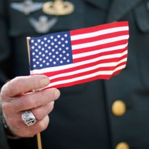 veteran20holding20american20flag2c20veterans20day_36361460_21901550_ver1-0-2-1-jpg-3