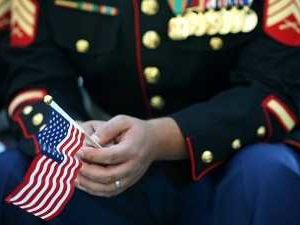 100026879-u-s-marine-holding-american-flag-veterans-day-26879-ver1-0-jpg