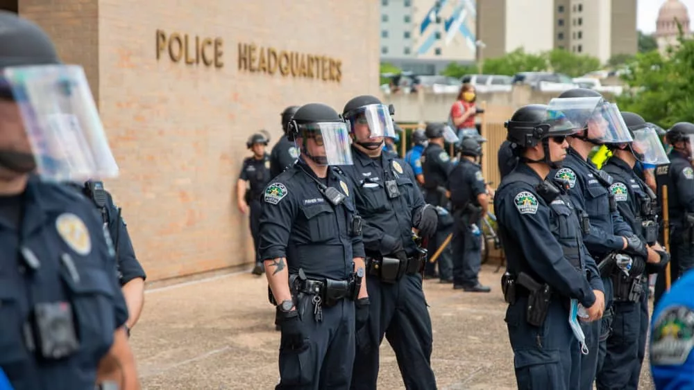 Austin^ Texas police officers w/protesters demonstrating against police brutality outside of City of Austin Police Department headquarters; May 30^ 2020: