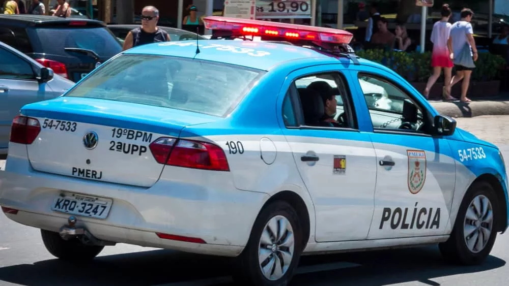 RIo de Janeiro^ RJ^ Brazil - March 20^ 2016: Rio de Janeiro Military Police car patrolling Copacabana waterfront