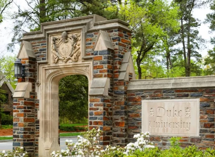 Entrance Sign of Duke University on campus of Duke University in Durham^ North Carolina^ Duke is a private top ranked research university in NC. Durham^ NC^ USA - April 16^ 2022