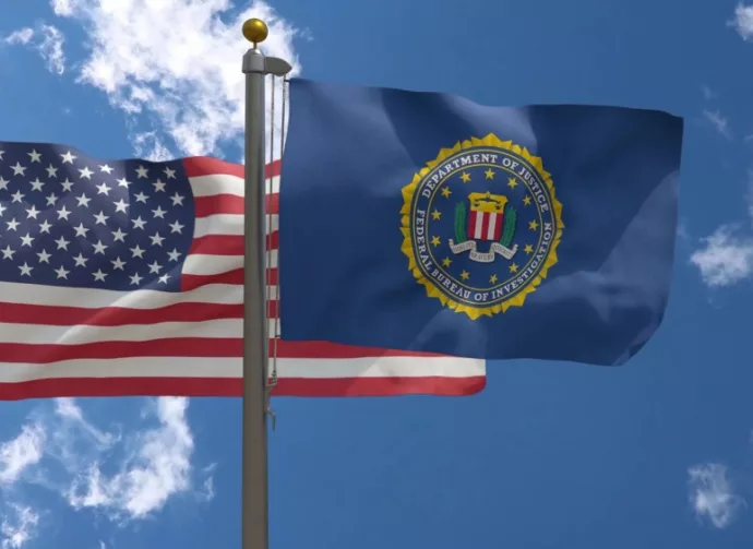 FBI Flag together with American Flag^ USA^ Close-up Frontal on a Pole with blue cloudy sky^ 3D Render