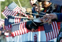 people-holding-american-flags-at-a-parade-1-609x419-jpg-6