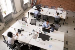 employees-working-together-in-modern-open-office-space