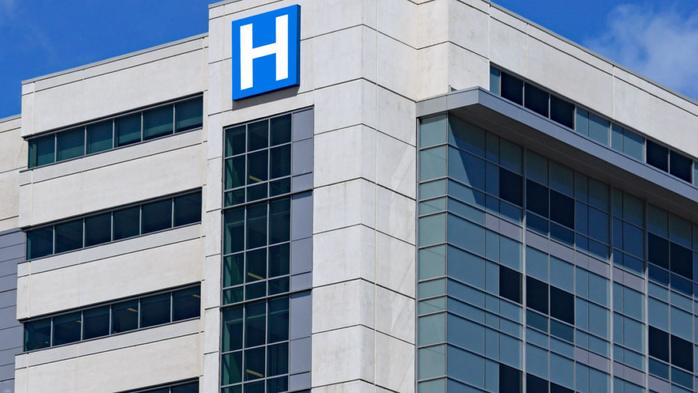 large-modern-building-with-blue-letter-h-sign-for-hospital-2