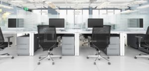 social-distancing-in-modern-office-office-desk-with-glass-partition-dividing-them