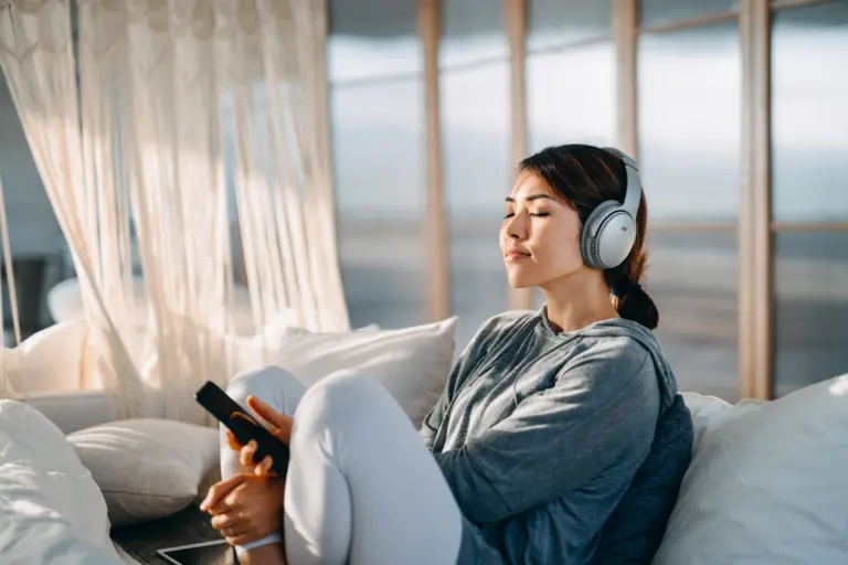 Person relaxing with pink noise for enhanced relaxation and stress relief.