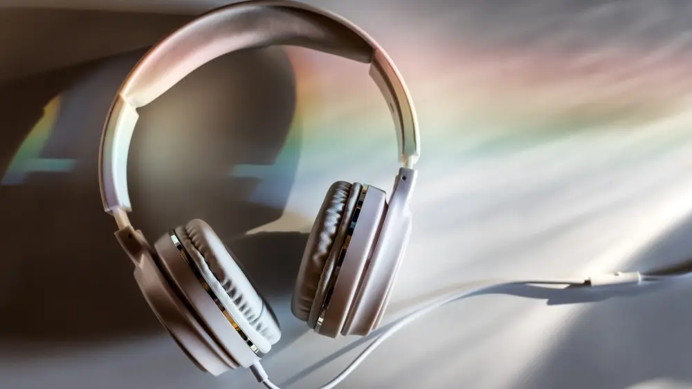 white-headphones-on-a-white-table-in-the-evening-light