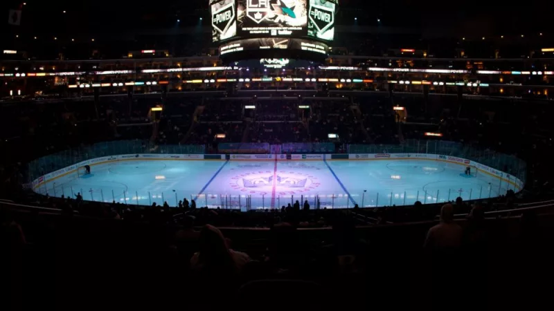 pro ice hokey rink lit up at nighttime