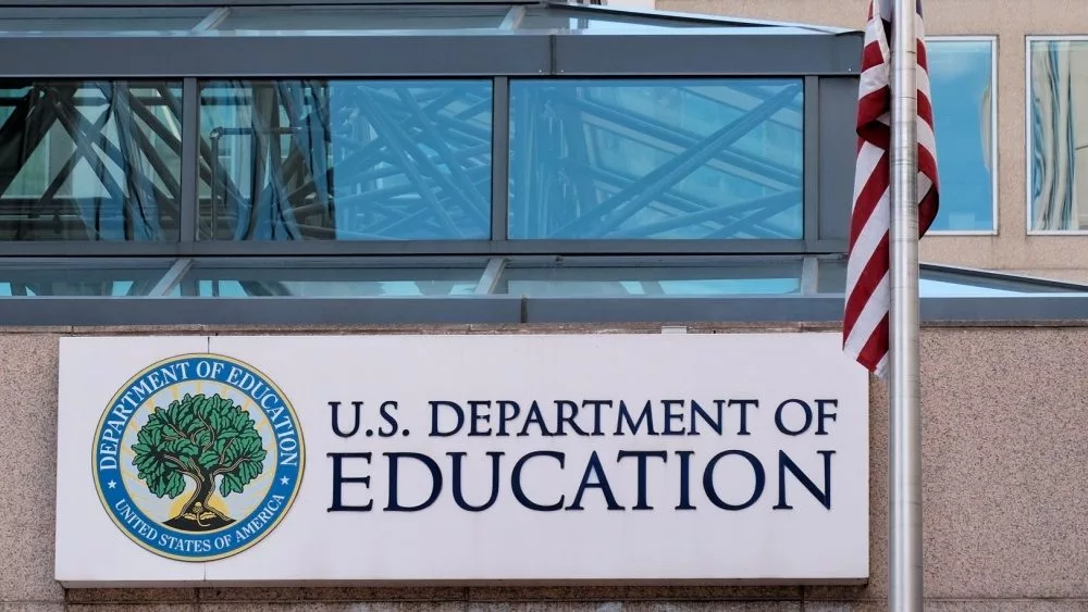 The exterior sign and US flag in front of the U.S. Department of Education offices. Washington^ DC USA; September 5^ 2024: