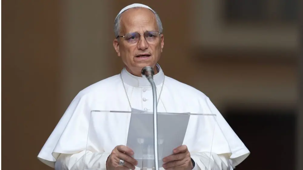 Pope Leo XIV recites the Angelus and imparts his blessing at the gates of the Apostolic Palace before thousands of faithful in Castelgandolfo. Castelgandolfo^ Italy - August 17^ 2025