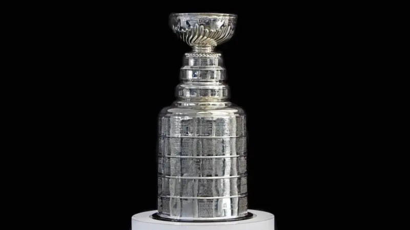 NHL ceremony - Stanley Cup trophy on the white stand^ black background^ Vancouver BC - October 22^ 2018