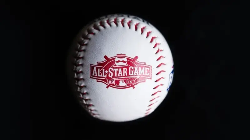 Close up baseball printed with logo for the 2015 Major League Baseball All-Star Game isolated on a dark black background. Cincinnati^ Ohio^ USA - July 21 2022