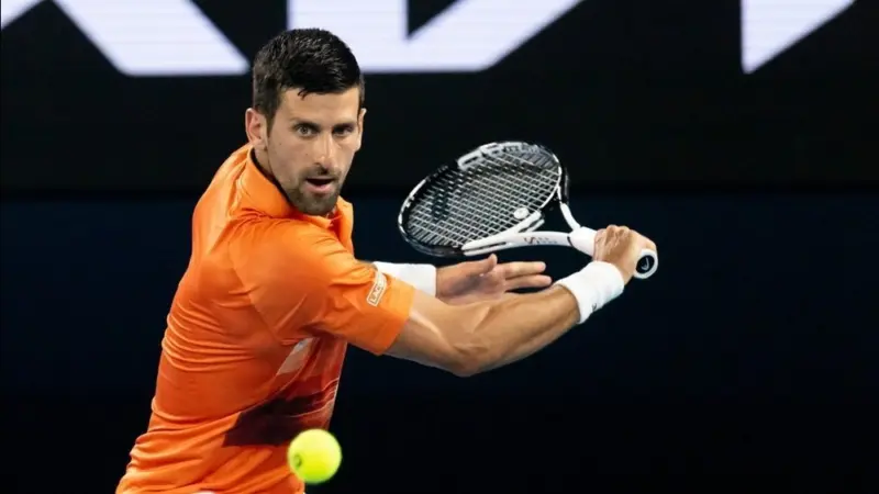Novak Djokovic of Serbia hits a shot to Nick Kyrgios of Australia in an Arena Showdown charity match ahead of the 2023 Australian Open at Melbourne Park MELBOURNE^ AUSTRALIA - JANUARY 13