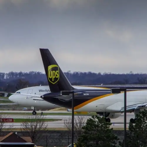 Louisville^ KY—March 6^ 2018 air cargo planes taxi to end of runway prior to take off