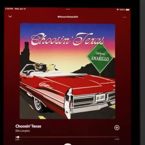 An Apple iPad displays the Spotify music streaming application^ which is playing the song "Choosin' Texas" by the artist Ella Langley