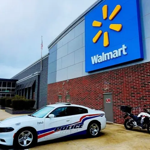 Police car parked in front of Walmart Store^ Fayetteville^ North Carolina^ USA^ August 6^ 2025