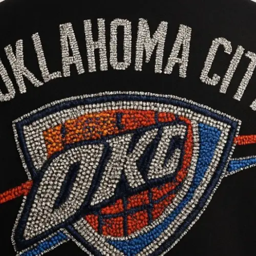 OKLAHOMA CITY THUNDER IN ALL RHINESTONES AS PATCH ON BACK OF MENS VARSITY JACKET AI-generated image / This content was generated by an Artificial Intelligence (AI) system.