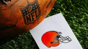 CLEVELAND^ USA^ FEBRUARY 10^ 2025: Cleveland Browns NFL team Logo and American football ball on Green Grass.